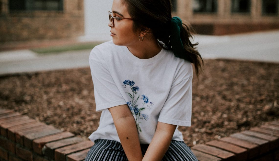 Lady sat on a wall