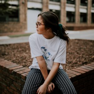 Lady sat on a wall