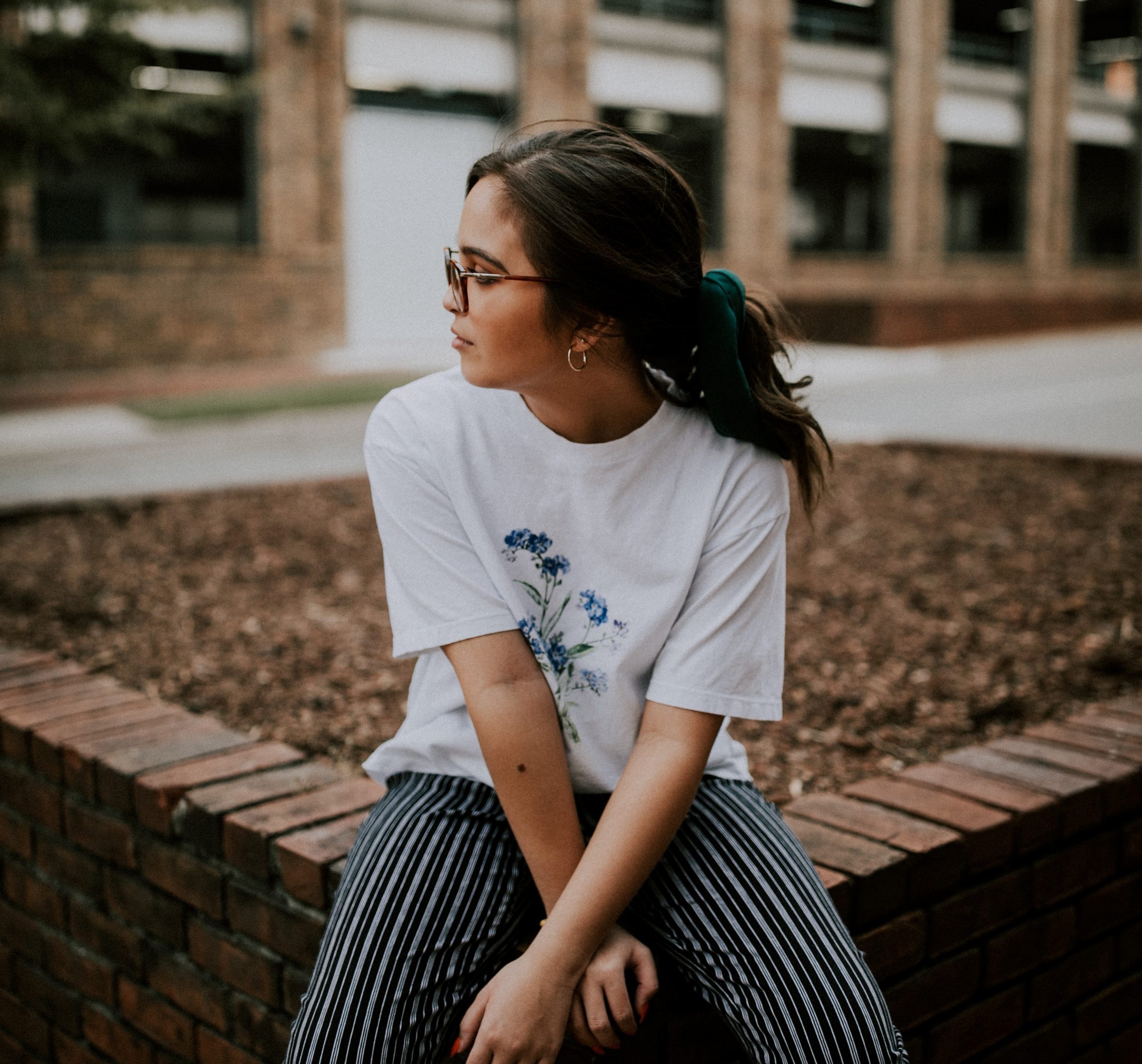 Lady sat on a wall